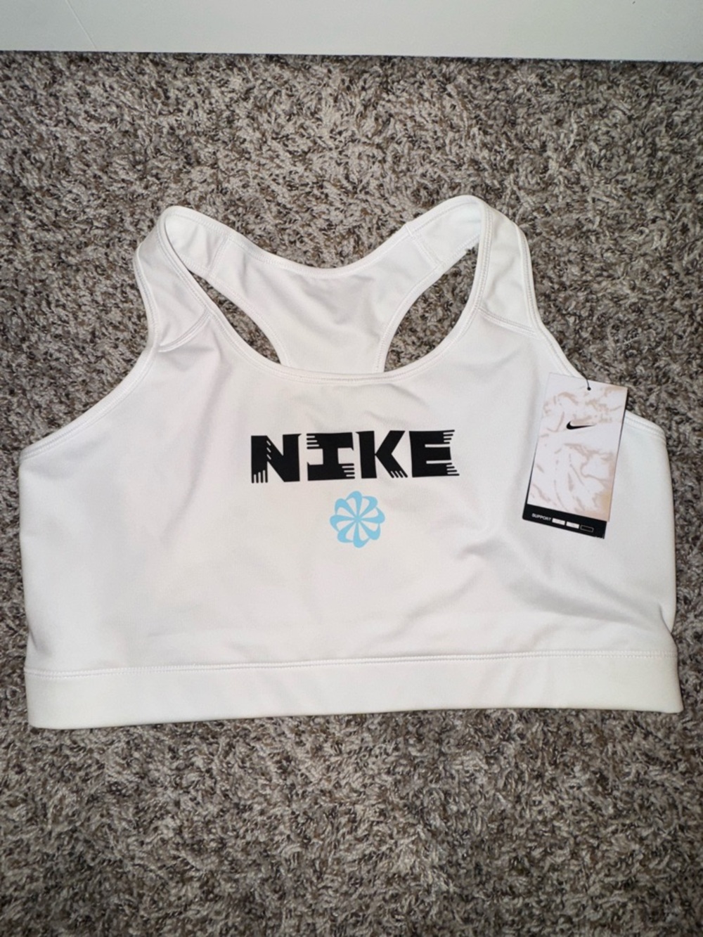 Nike White Sports Bra with Black Logo and Light Blue Accent